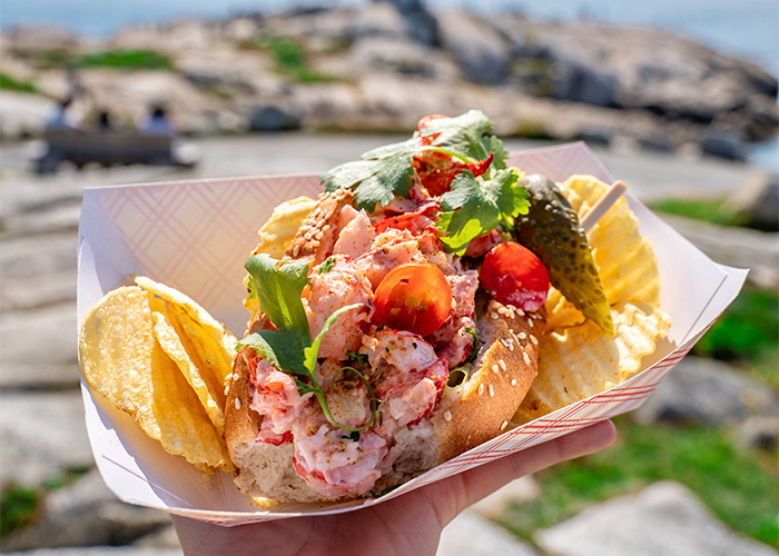 Close up of a fresh lobster roll in Peggy's Cove.